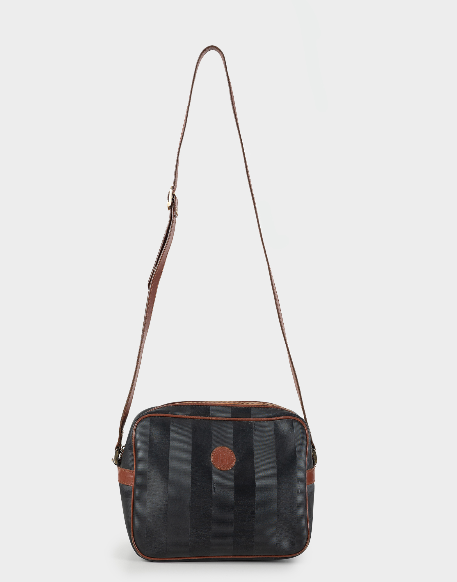 black canvas women's bag with striped pattern and brown leather shoulder strap