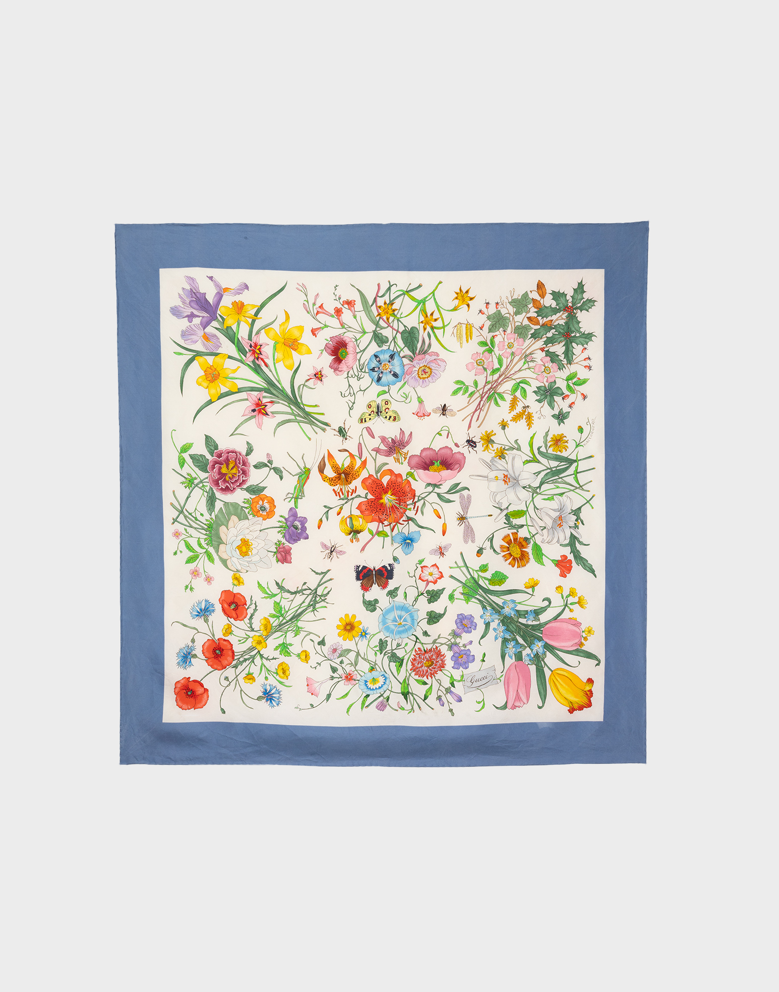 Gucci women's silk scarf with beige background, blue border and floral pattern in the centre