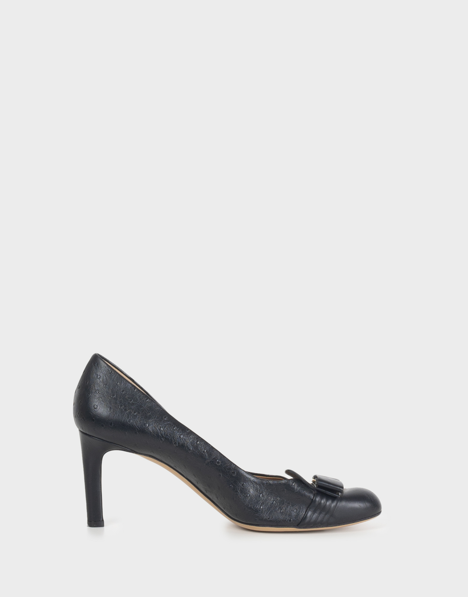 Women's black leather pumps with thin heels, round toe, and applied bow