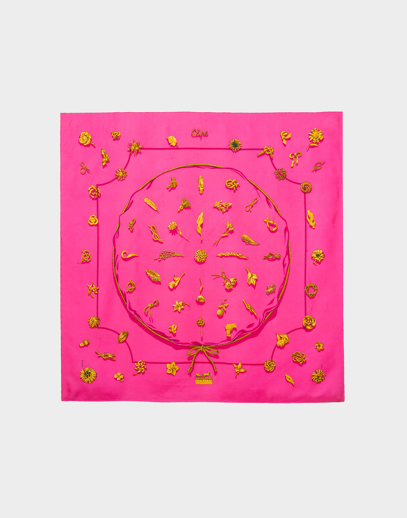 Square fuchsia silk scarf with pattern of golden objects