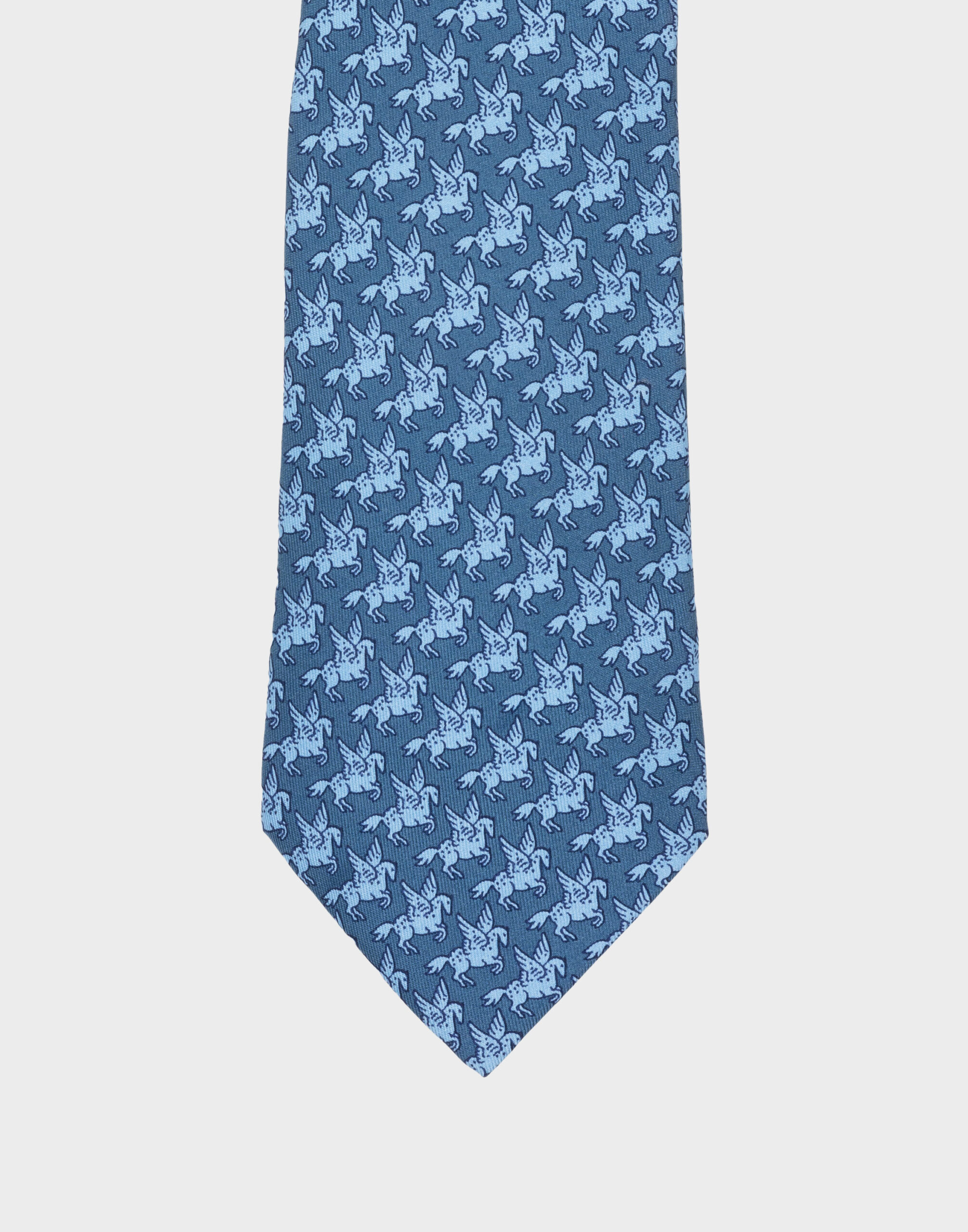 Men's light blue silk tie by Hermes featuring a pattern of winged horses