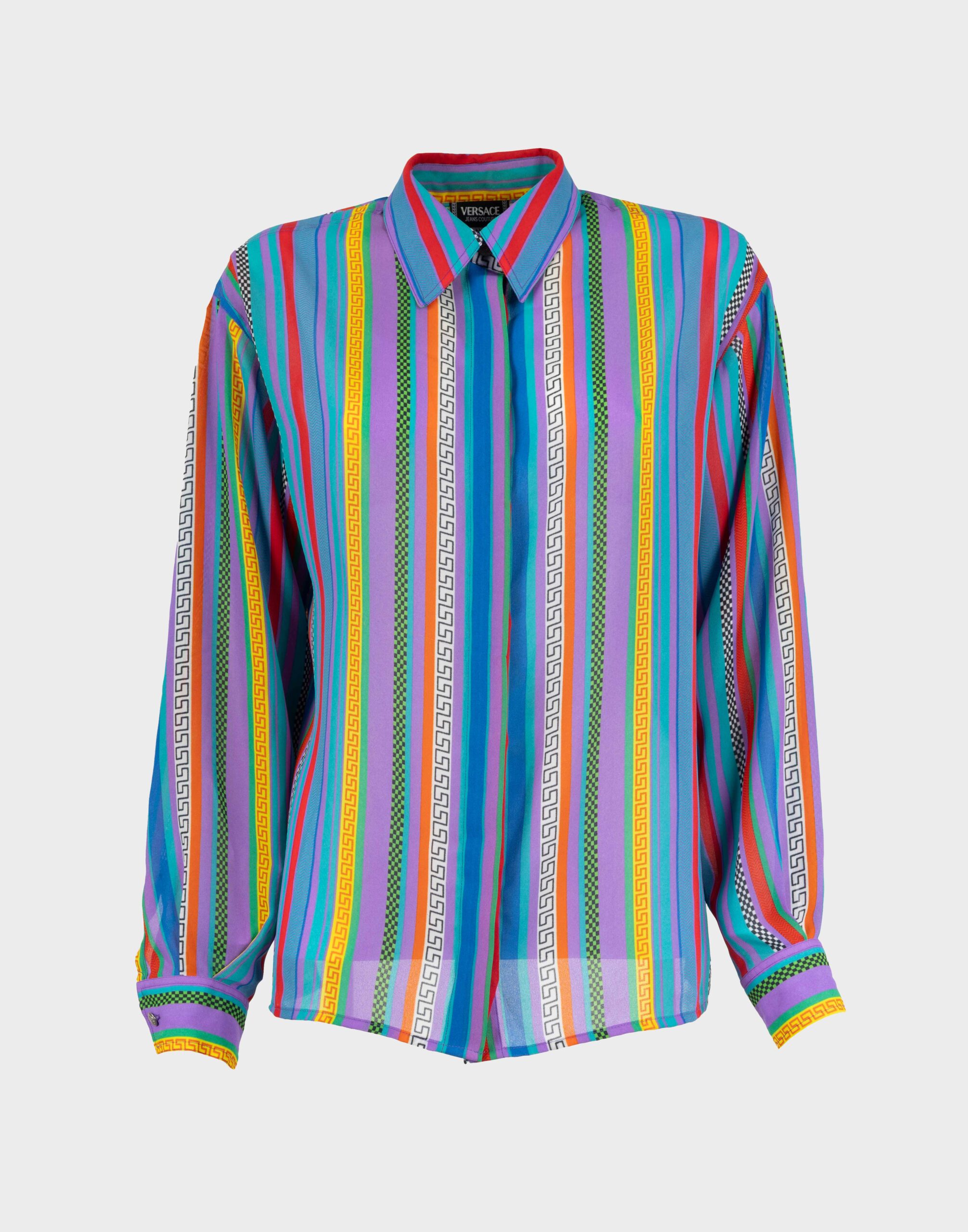 Women's shirt with multicolor stripes in purple, light blue, yellow, and a Greek fret pattern in semi-transparent fabric.