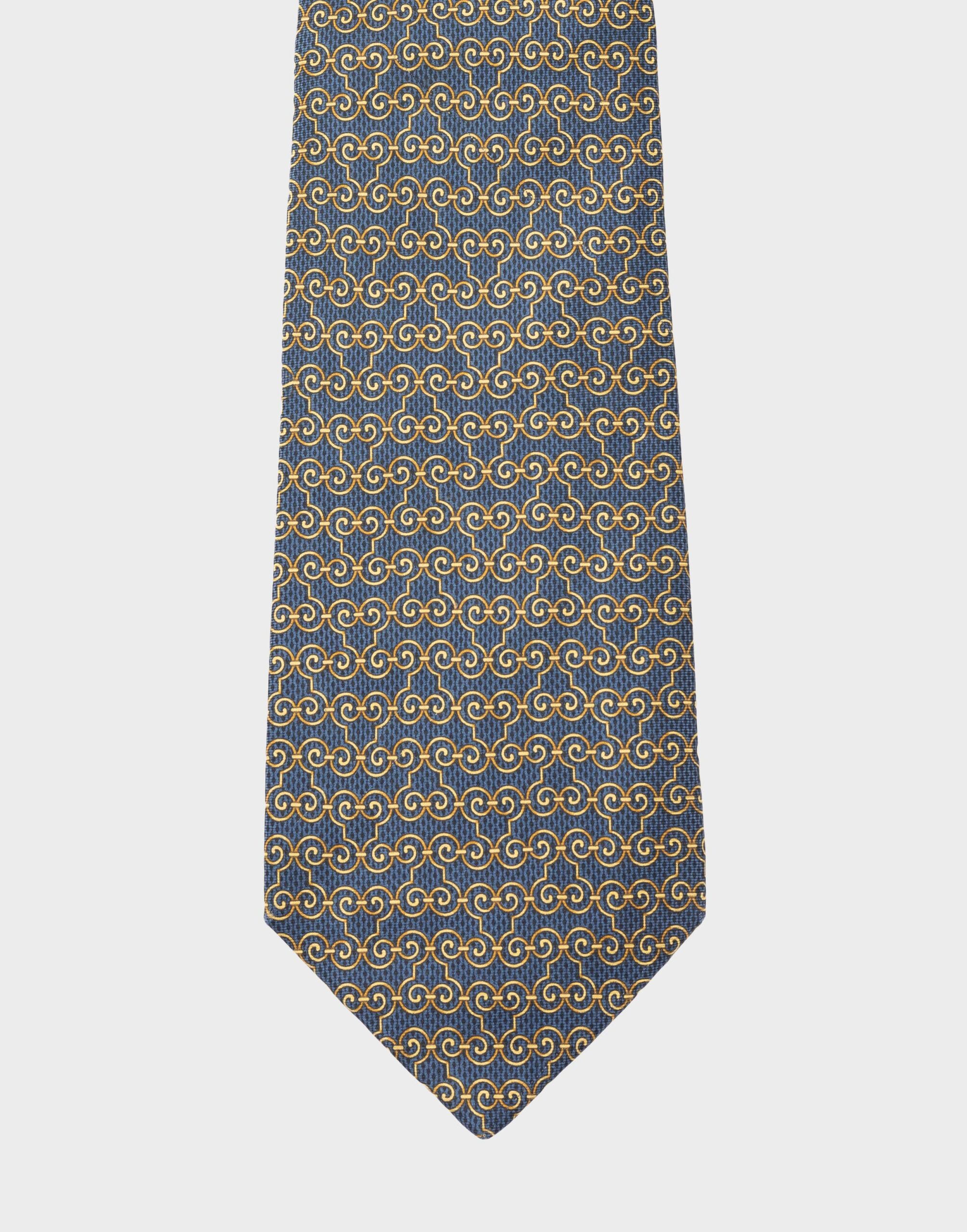 blue silk tie with gold geometric pattern