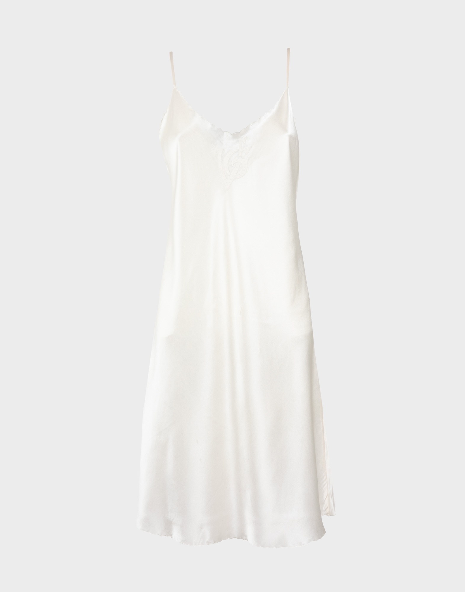 ivory-coloured women's silk skirt with thin straps, v-neck and embroidered logo on chest