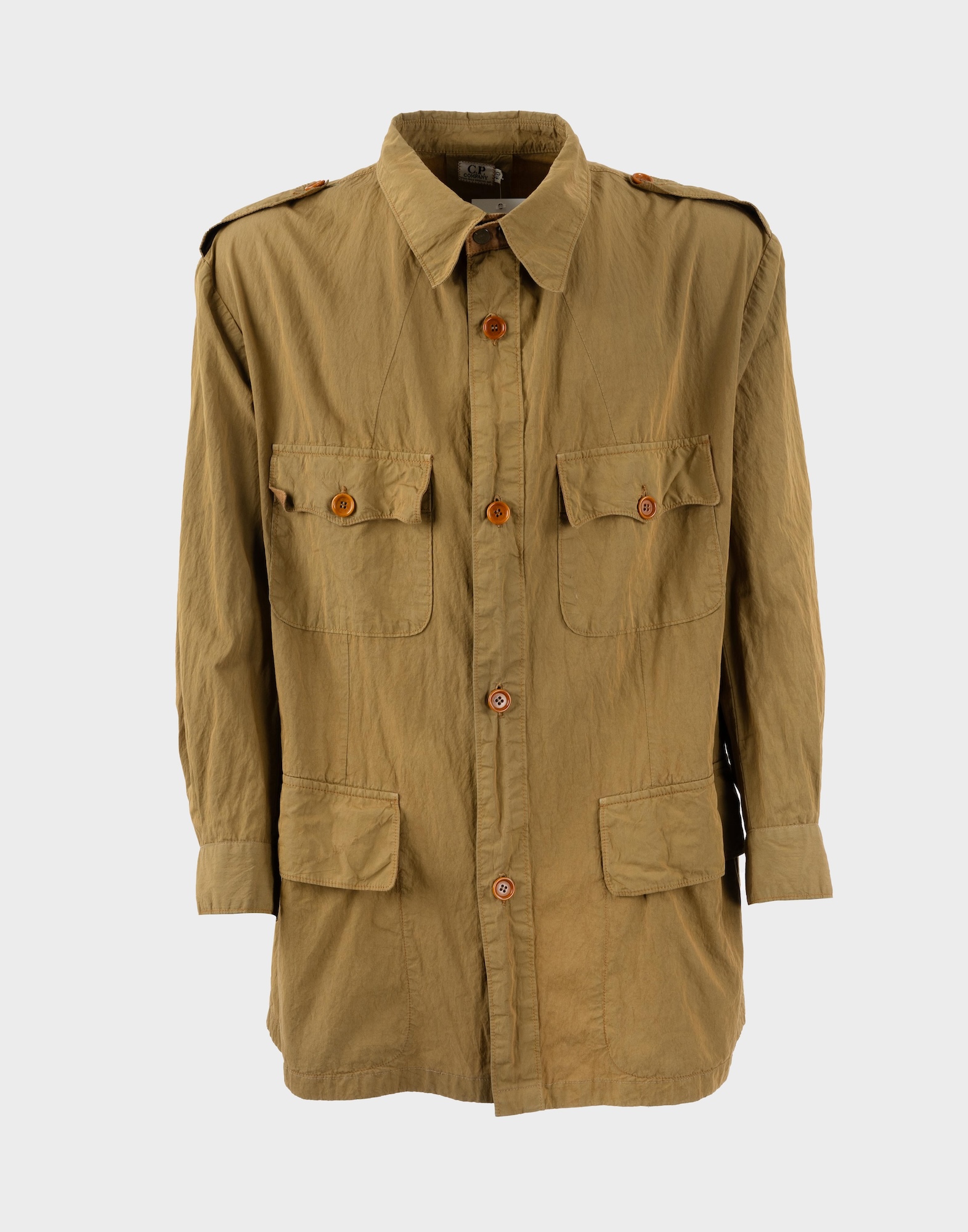 Beige safari jacket by C.P. Company with long sleeves, front fastening with brown buttons, four pockets on the front.