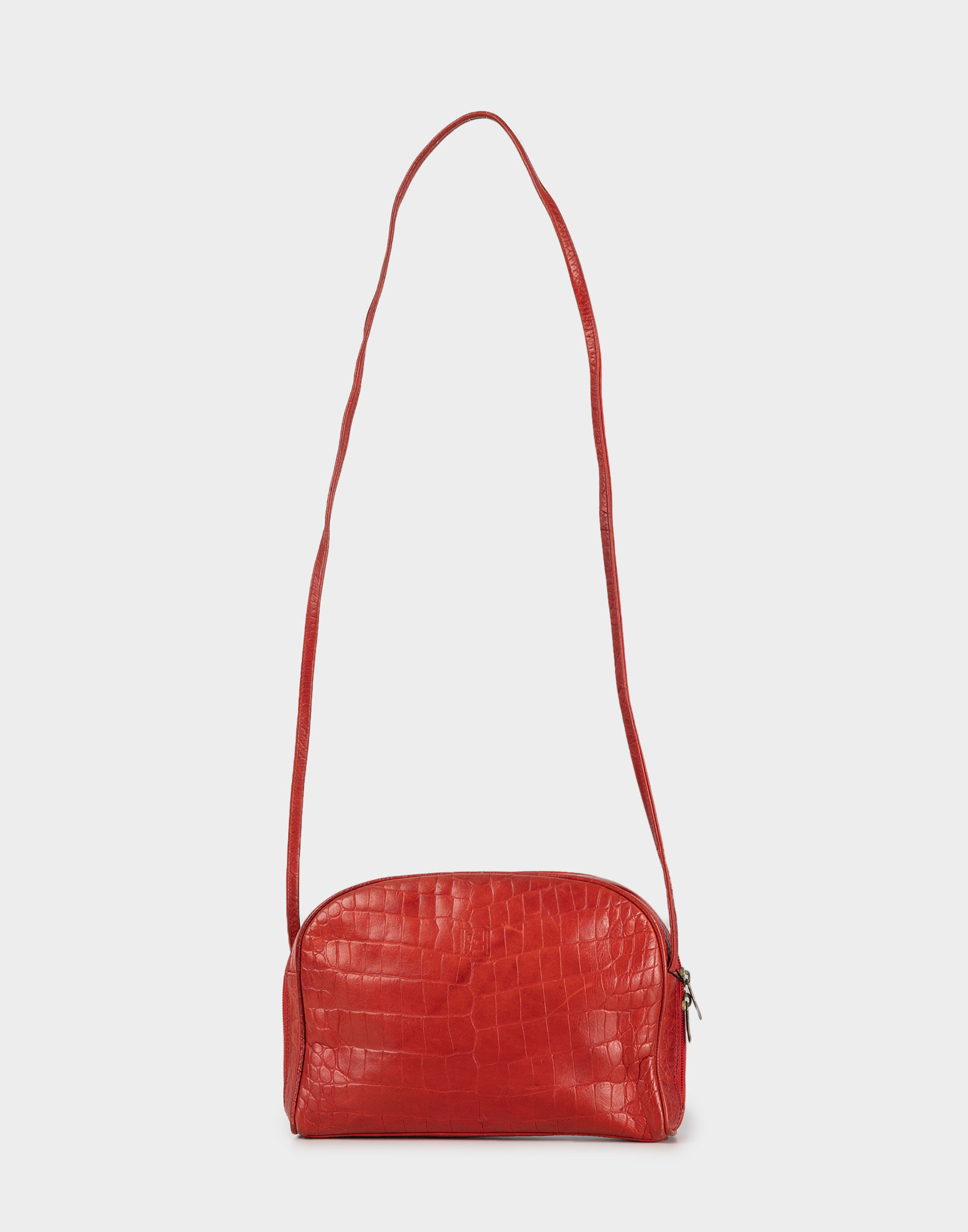 red women's leather bag with long shoulder strap, top zip fastening