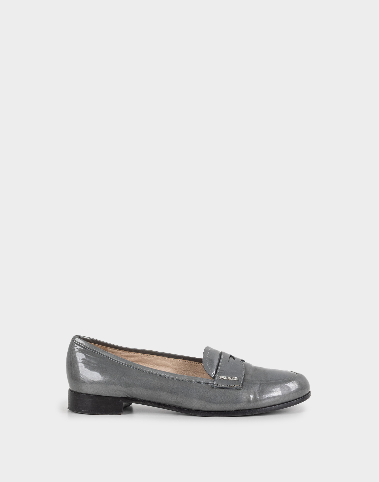grey leather women's moccasins with silver-coloured logo applied to the front