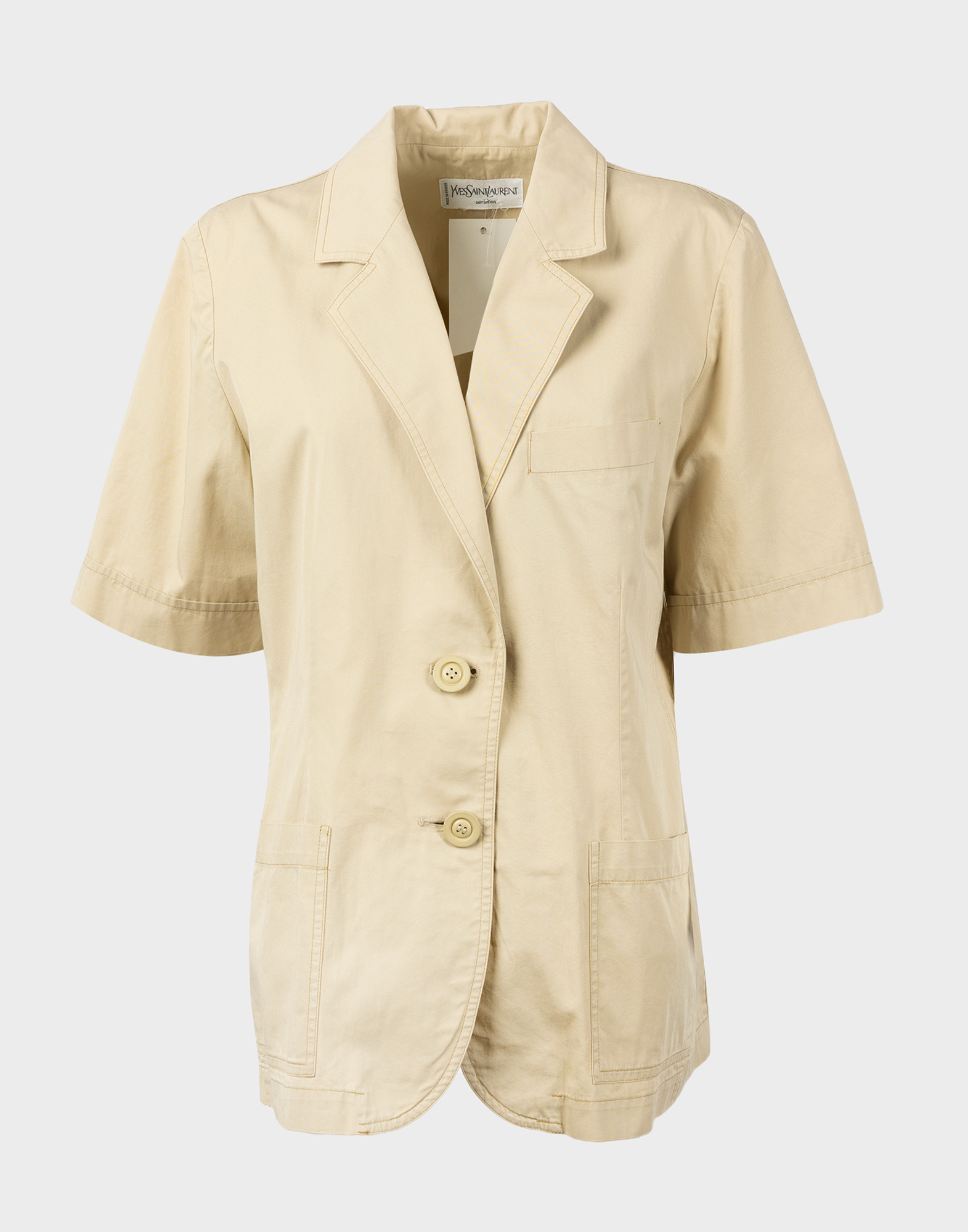 short-sleeved beige cotton ladies' jacket with contrast stitching. V-neck, two-button fastening, two front pockets