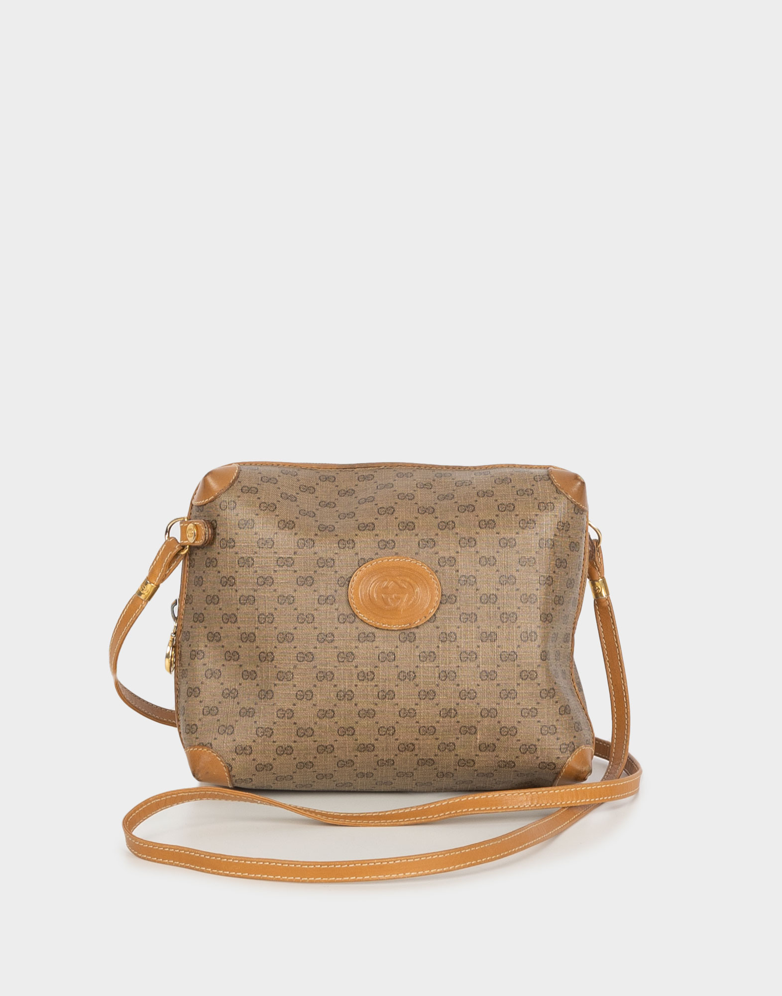 borsa piccola gucci marrone con monogramma GG, rifiniture in pelle marrone, tracolla sottile