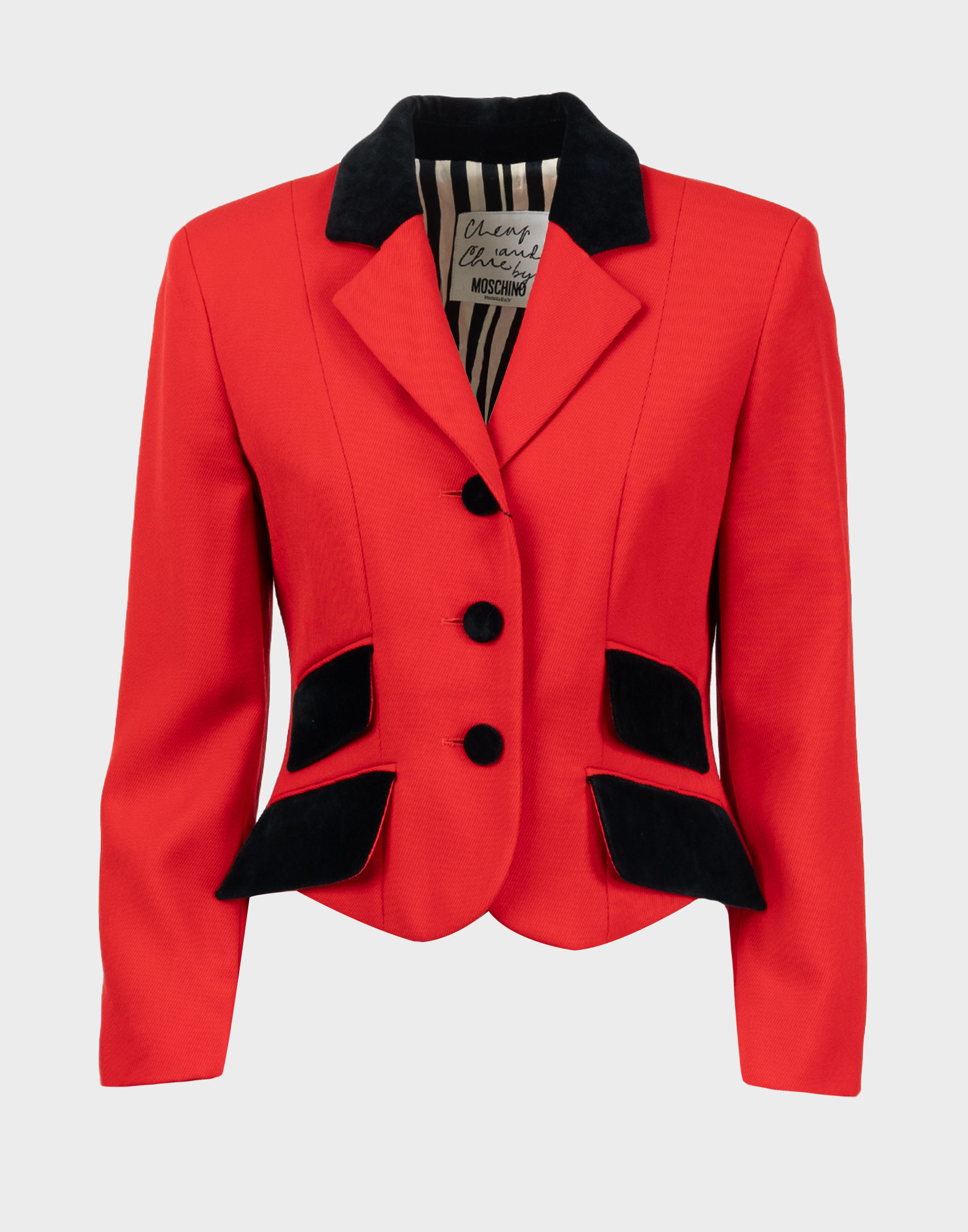 Cropped red women's jacket with long sleeves, black velvet lapels, buttons, and pockets.