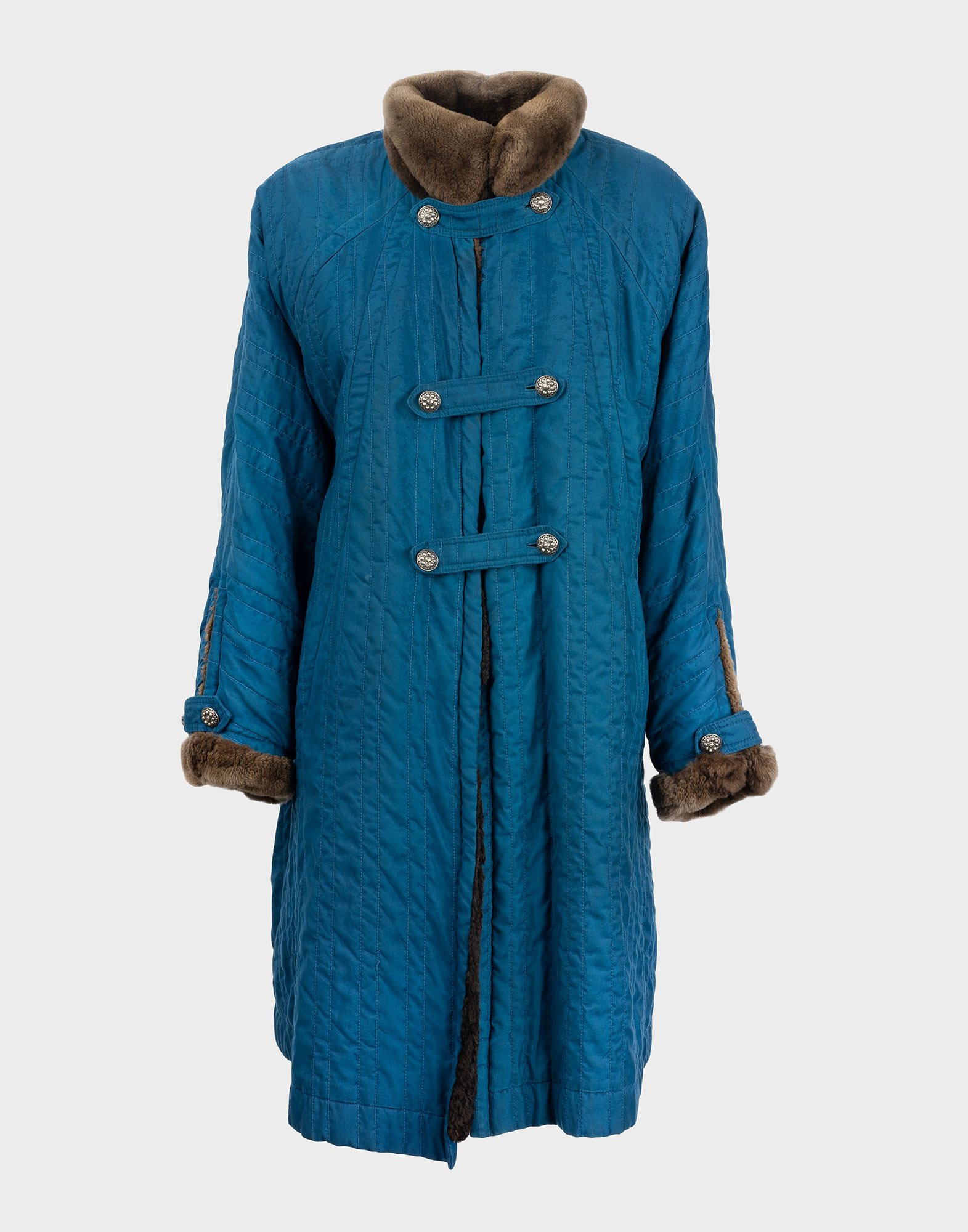 Cerulean blue women's coat in polyester with an oversized fit, featuring brown fur lining and a front button closure with silver buttons.