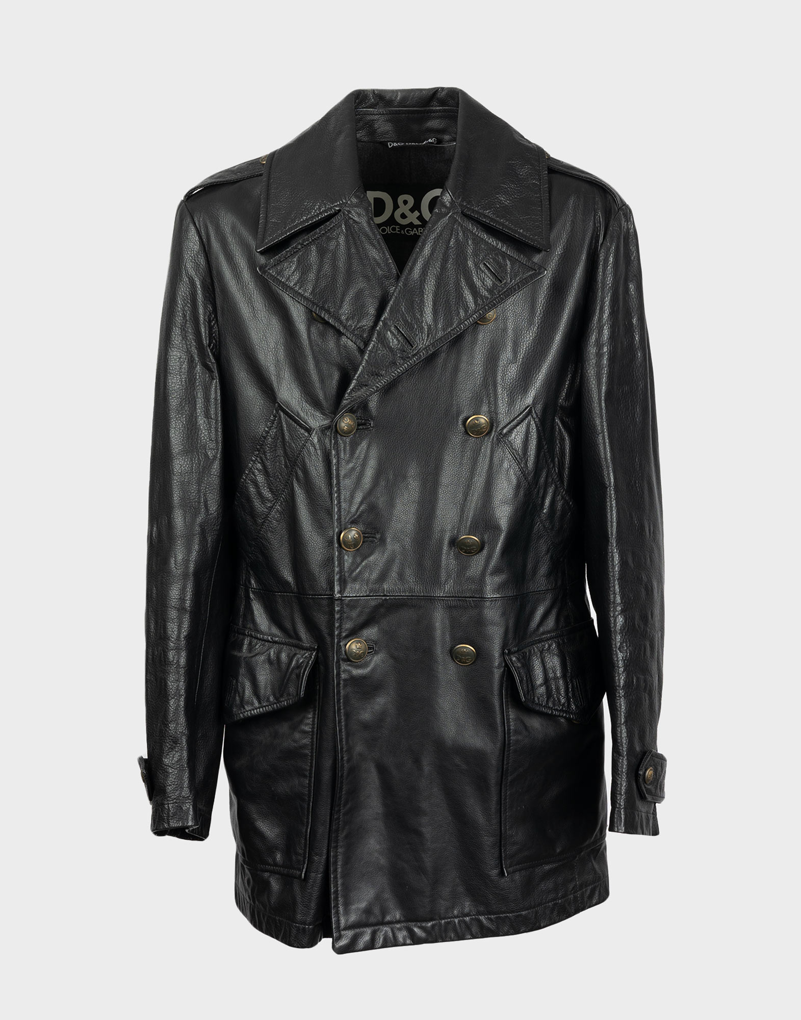 Men's black double-breasted leather trench coat with bronze-colored buttons on front, two large pockets on front and chest. v-neck.